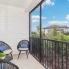a patio with chairs and a table