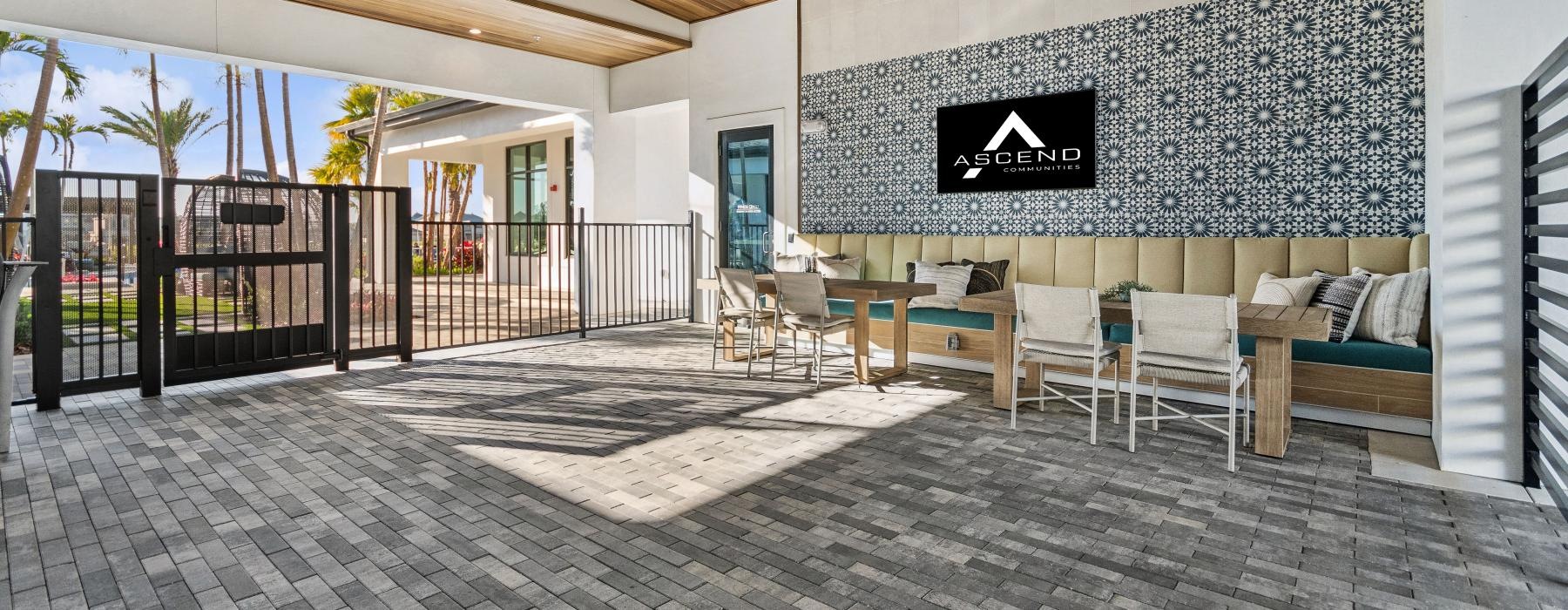 an open patio with table and chairs
