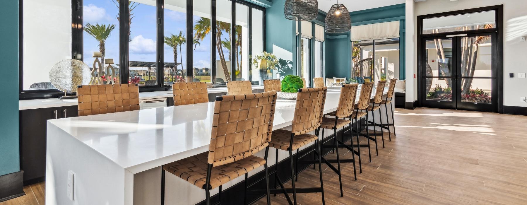 a large bar with seating and with a large window